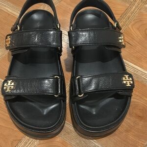 Tory Burch  Black Leather Sandals with Gold Emblems
